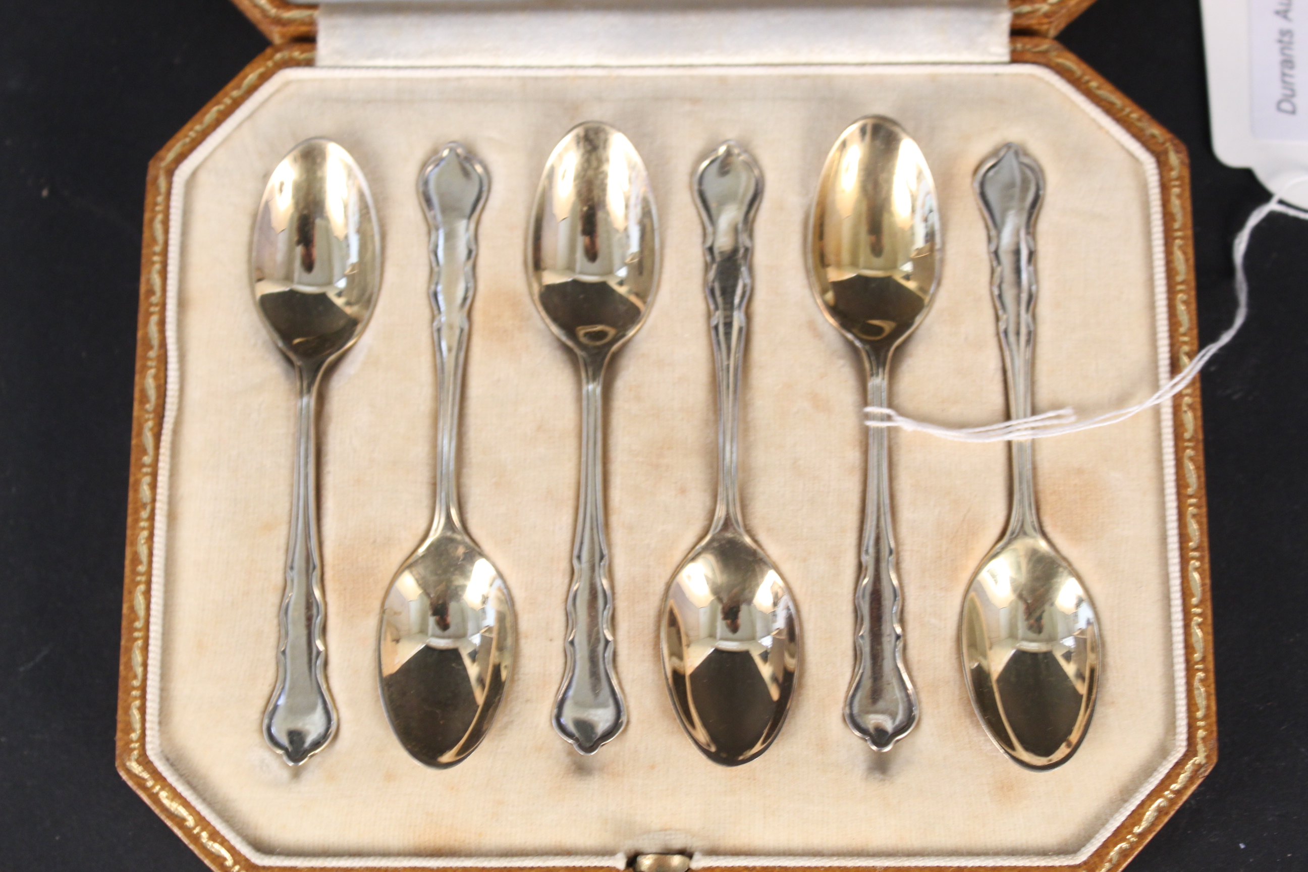 A boxed set of Harrods silver gilt coffee spoons,