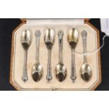 A boxed set of Harrods silver gilt coffee spoons,