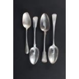 Three Georgian silver serving spoons (various makers) together with a bottom struck silver spoon,