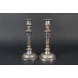 A pair of 19th Century silver plate on copper table candlesticks with foliate decoration,