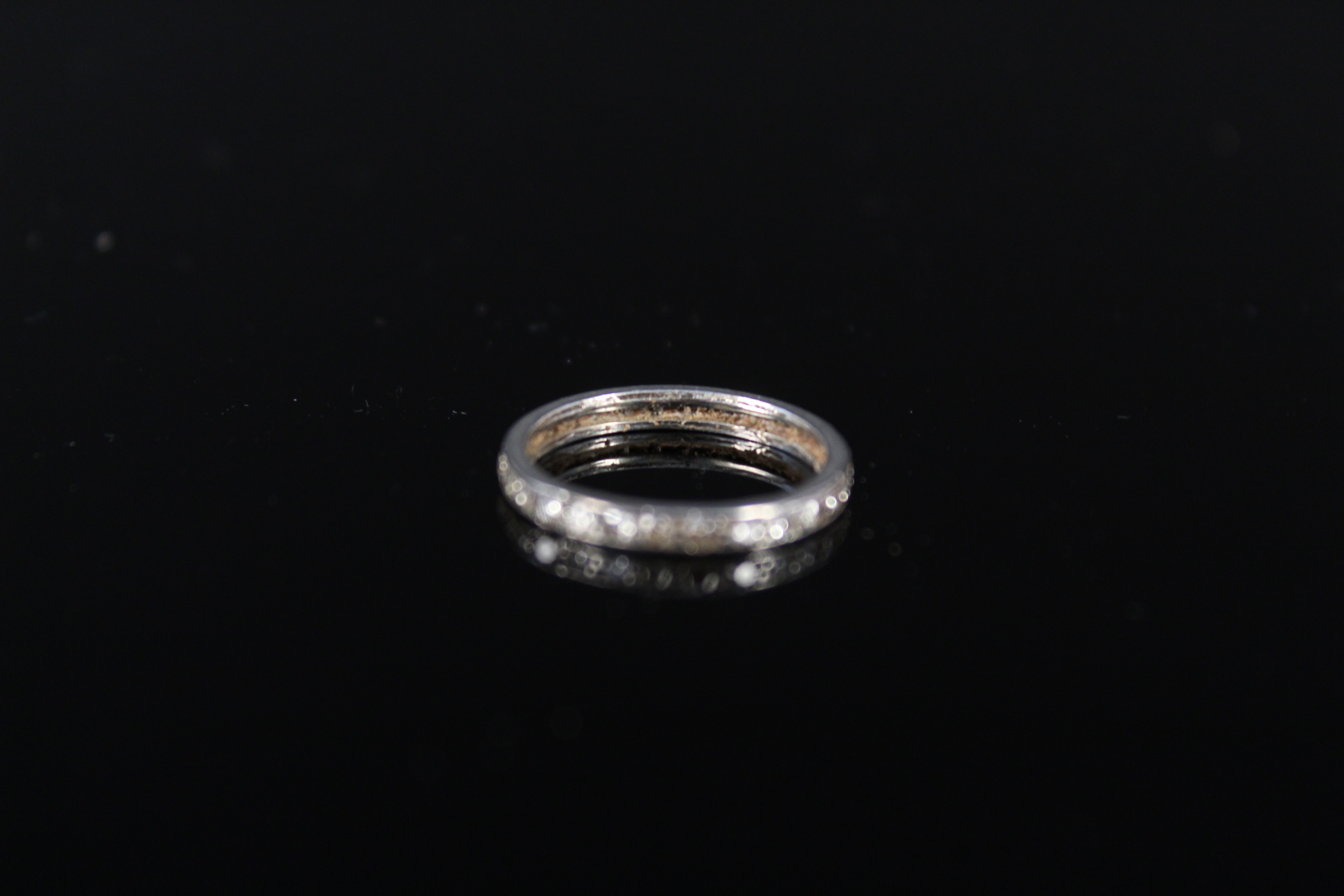 A white metal diamond set eternity ring, size J 1/2, approx 1. - Image 2 of 3