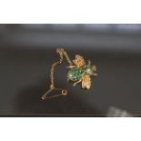 A 14ct gold insect fly brooch set with emeralds and diamond,