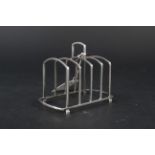 A silver four slice toast rack, Birmingham 1922 by Martin Hall & Co Ltd,