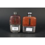 Two glass hip flasks with detachable silver plated cups