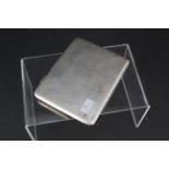 A large silver cigarette case with engine turned decoration engraved with initials to front and