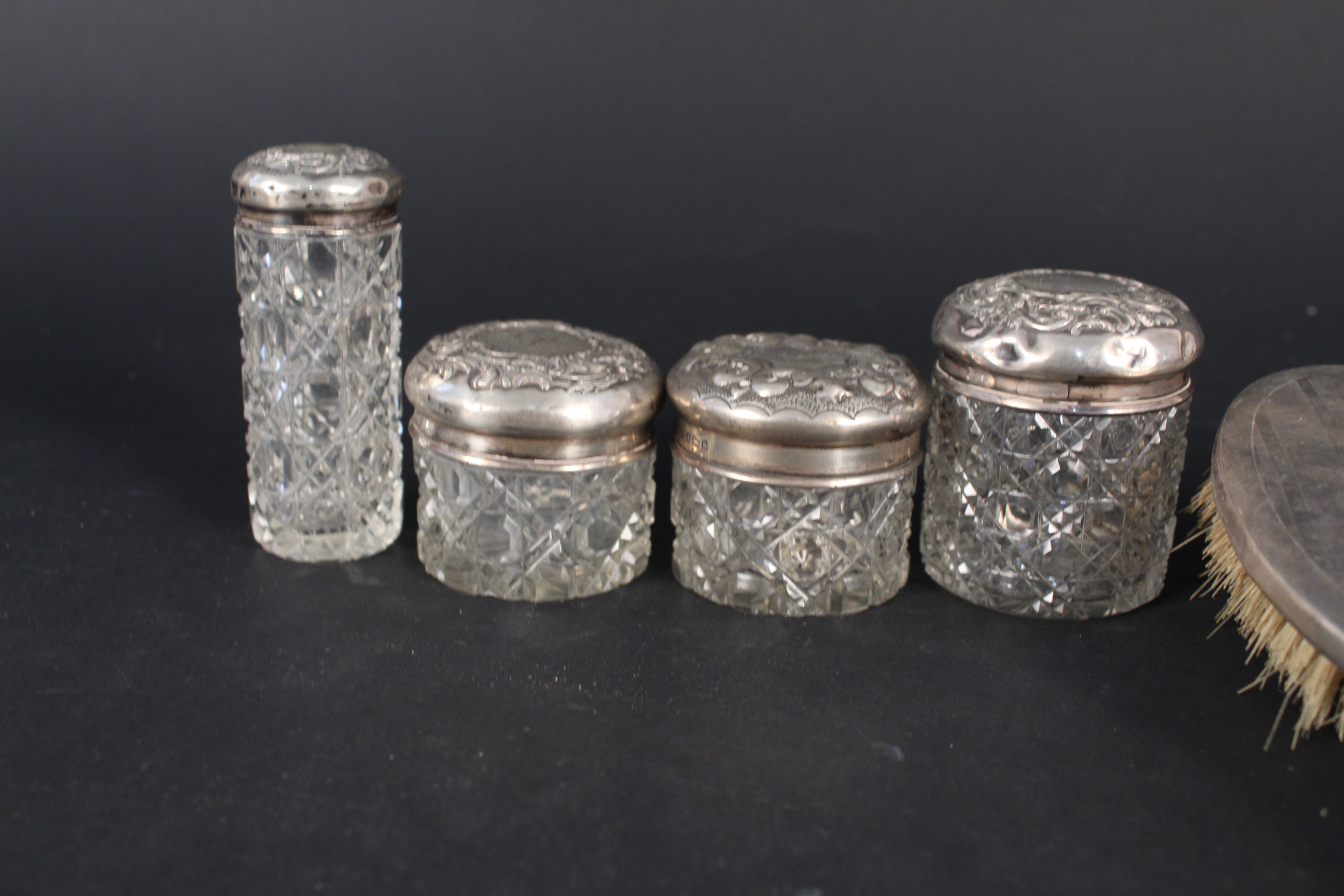Four cut glass silver lidded dressing table jars and three silver backed brushes - Image 2 of 3