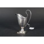 A silver 'helmet' cream jug, Birmingham 1921 by Sanders & Mckenzie,