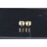 A pair of 18ct Tiffany & Co diamond etoile stud earrings, each with six platinum set diamonds,