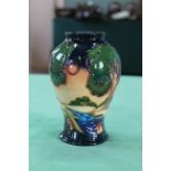 A Moorcroft 'Evening Sky' pattern vase, 2003 by Emma Bosson, 6" high,