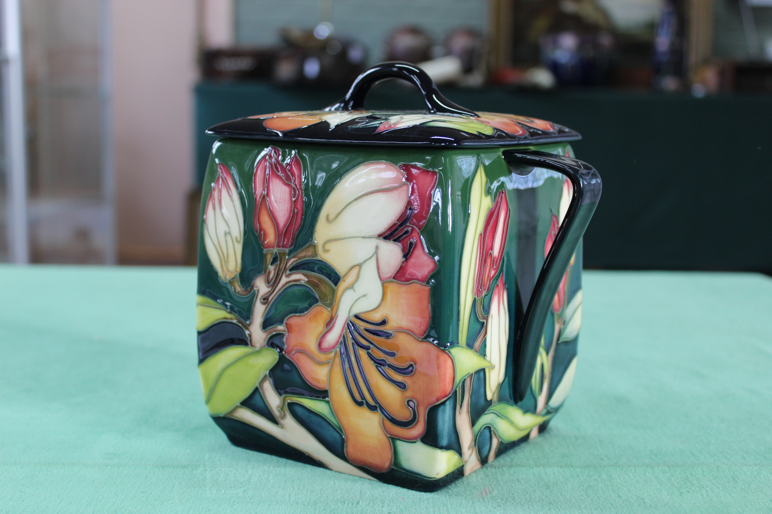 A Moorcroft 'Pen Carrow' pattern squat lidded twin handled box vase, 2005 by E Bossons, 7 1/4" high,