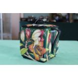 A Moorcroft 'Pen Carrow' pattern squat lidded twin handled box vase, 2005 by E Bossons, 7 1/4" high,