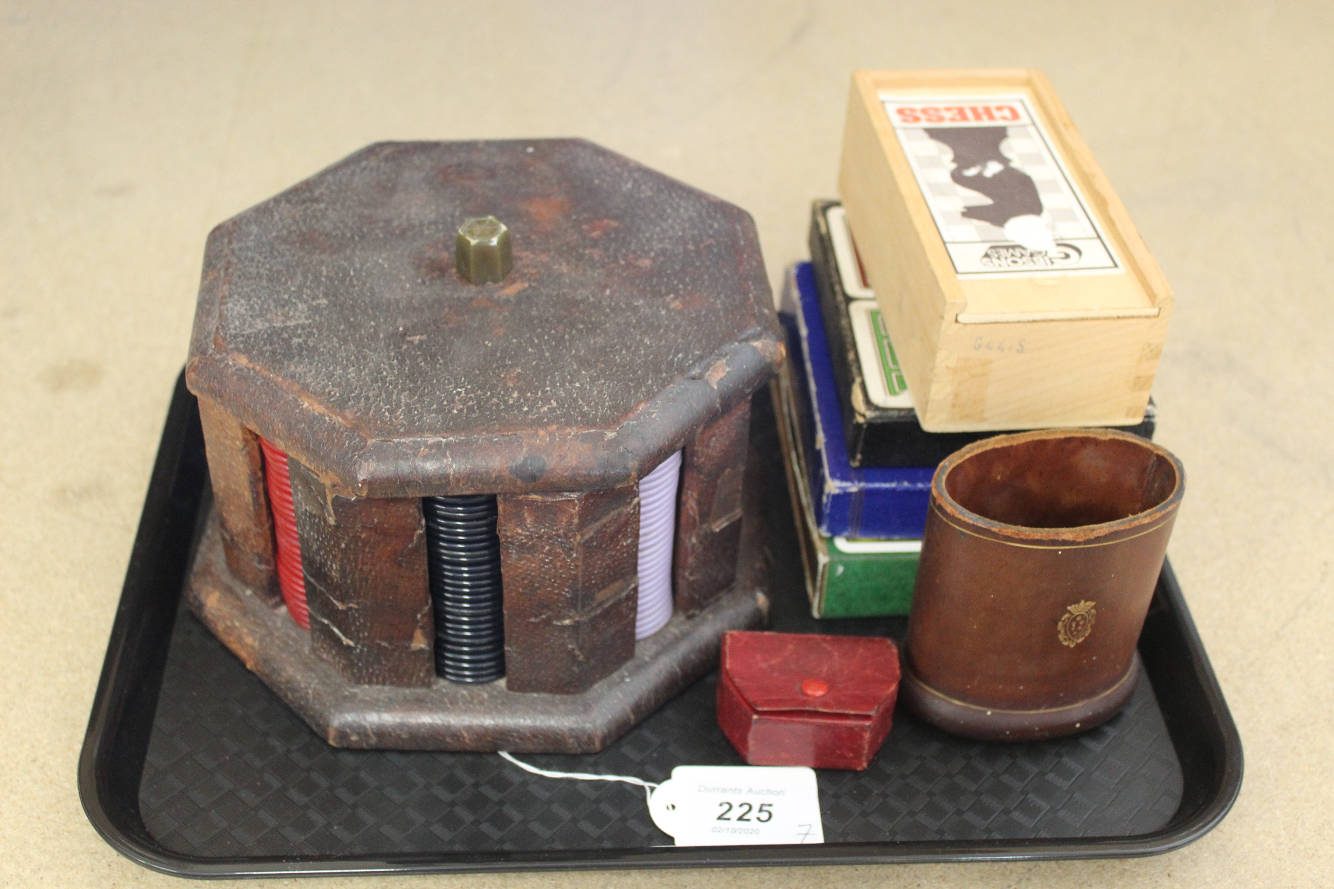 Three double sets of vintage playing cards, a games chip dispenser, leather dice shaker,
