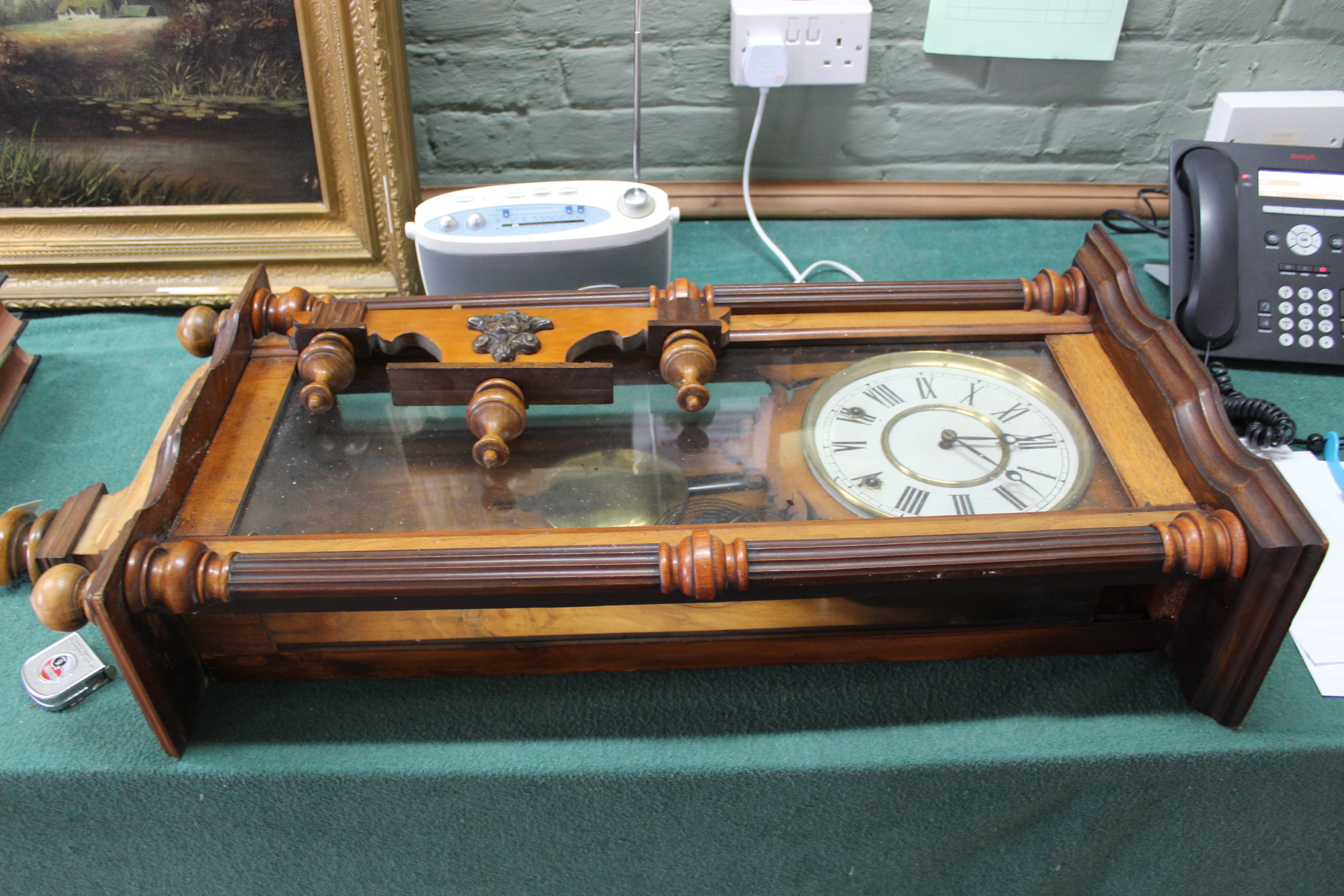 A late 19th Century walnut cased Vienna wall clock