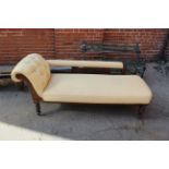 An Edwardian mahogany framed upholstered chaise longue