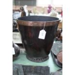 A George III leather bucket of fine original patina with riveted copper rim,