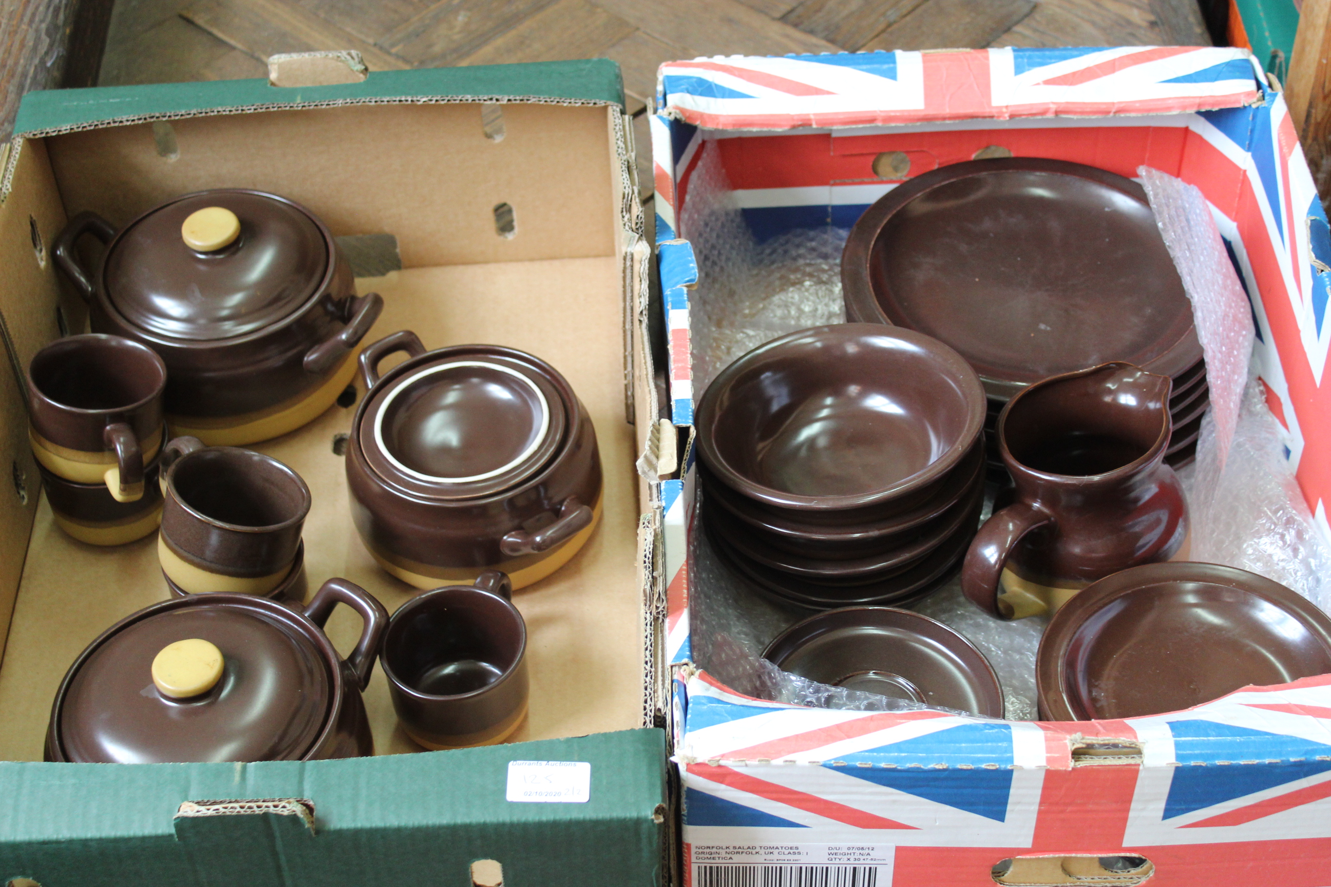 A two tone colour stoneware dinner service including tureens (two trays)