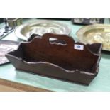 A 19th Century mahogany two division cutlery box with integral handle and shaped rim,