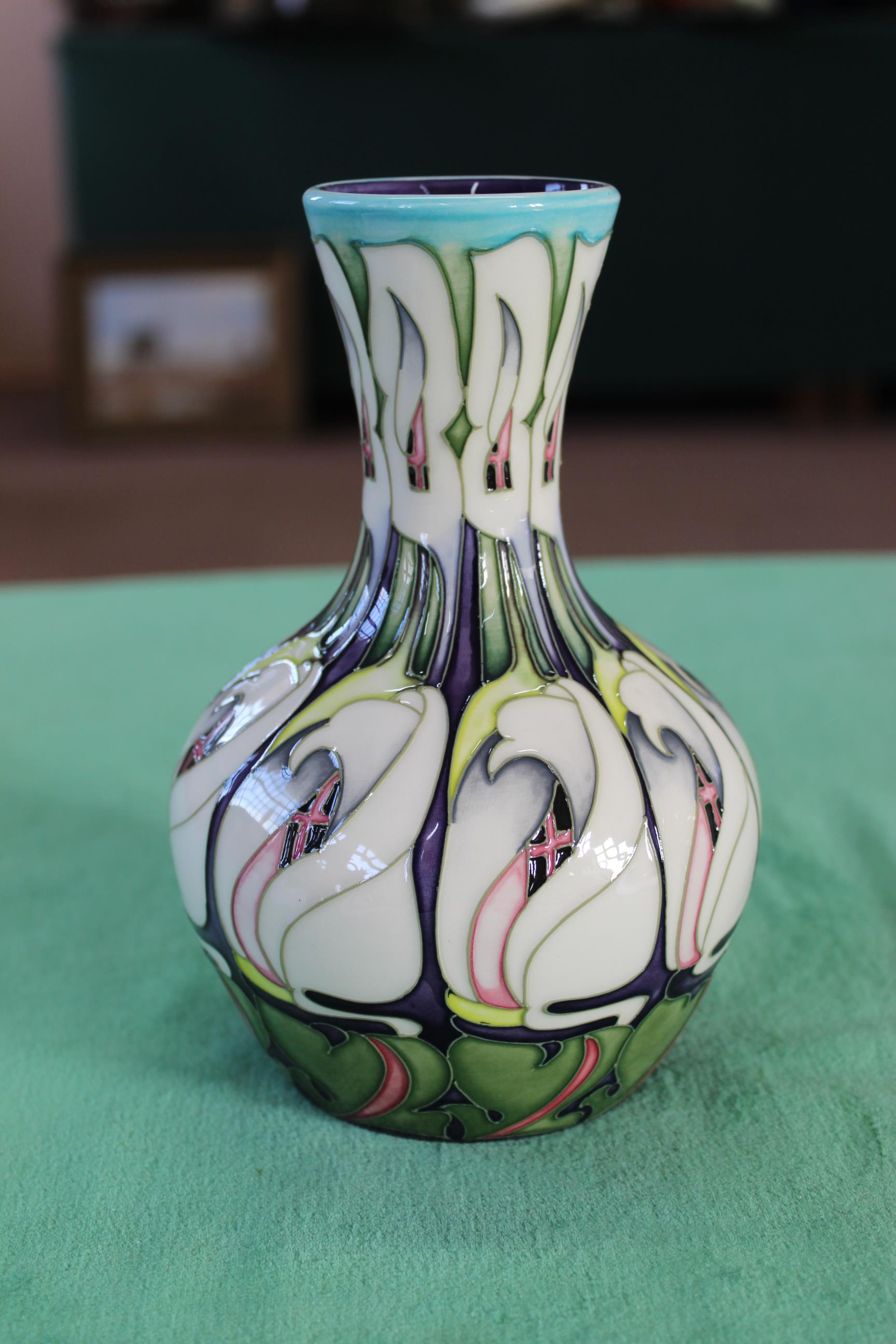 A Moorcroft 'Lily Come Home' pattern vase, 2006 by E Bossons, 7 1/2" high,