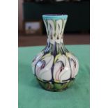 A Moorcroft 'Lily Come Home' pattern vase, 2006 by E Bossons, 7 1/2" high,