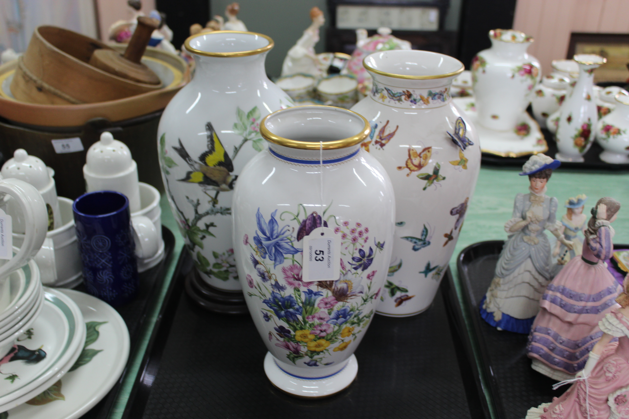 Three porcelain vases with flowers,