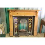 An Edwardian fireplace with pine surround
