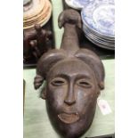 A carved Nigerian 'Igbo' mask