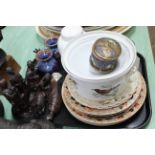 A tray with a selection of Victorian plates, a French casserole dish,