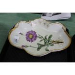 A serving dish painted with an 'Alpine Aster' flower with a shaped gilded border,