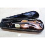 A cased violin and bow, violins label bears 'Anno 1773 Carlo Bergonzi,