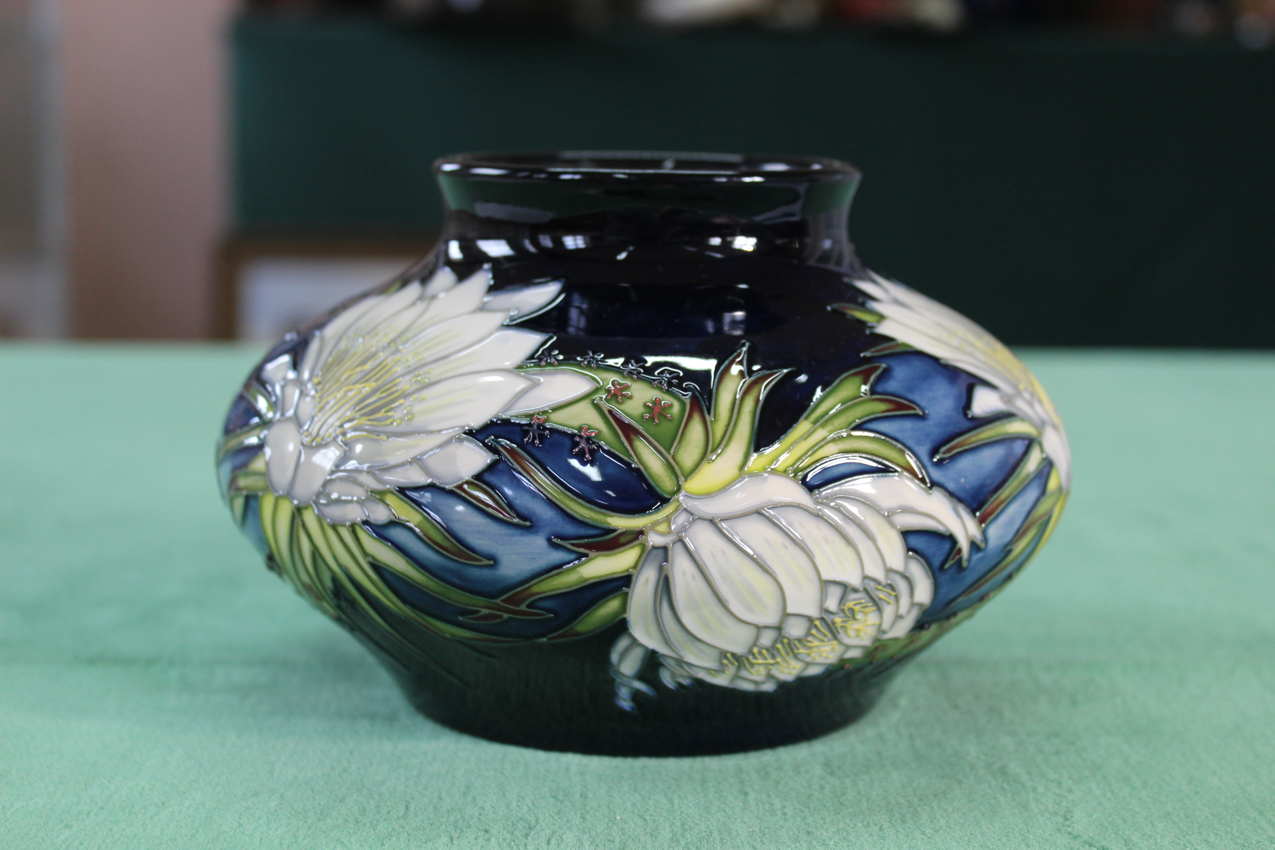 A Moorcroft 'Queen of the Night' squat vase, 2001 by Angela Davenport, 4 1/2" high,