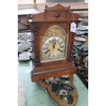 A mahogany cased striking mantel clock (lacking key),