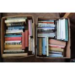 Two boxes of books on dogs and dog training covering a wide variety of breeds