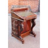 A Victorian style mahogany Davenport with green inset leather top
