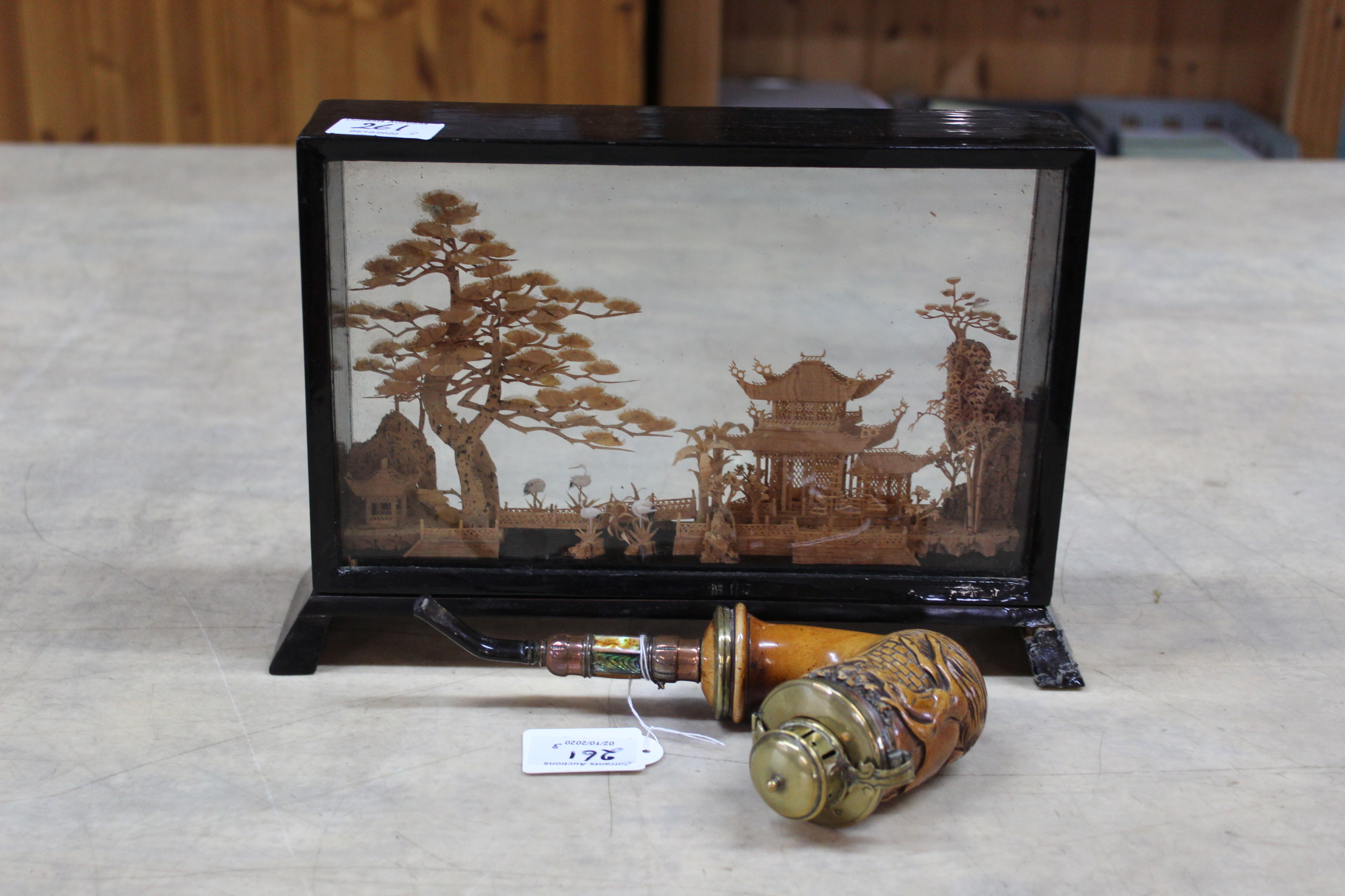 A Tyrolean brass mounted pipe plus a cased sandalwood cut out model of a Chinese temple with trees