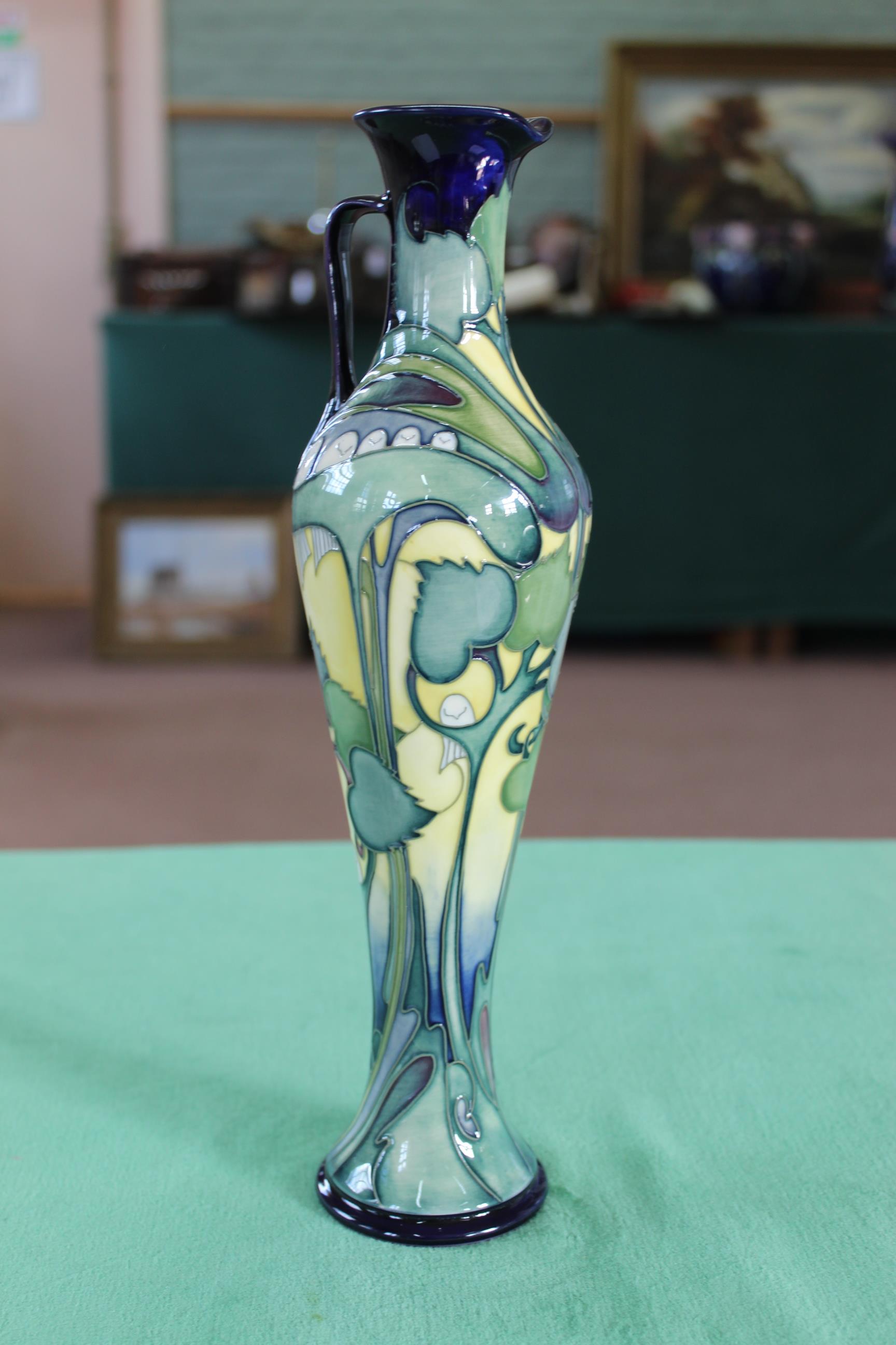 A Moorcroft 'Tree Doves' pattern slim ewer, 2005 by E Bossons, limited edition 31/200, 12 1/4" tall,