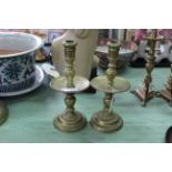 A pair of heavy antique Dutch brass Heemskerk candlesticks with ejection nozzles, knopped stems,