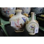 Two Worcester flask vases, one with bird portraits, the other with butterflies and flowers,