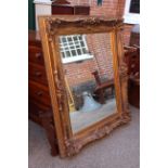 A large modern gilt mirror