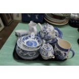 A tray of blue and white decorated tea and table wares