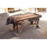 A Cameroonian hardwood bench featuring two figures