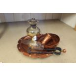 A round petal edged hammered copper tray, three copper bowls,