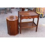 An Edwardian mahogany pot cupboard and an oak hostess trolley