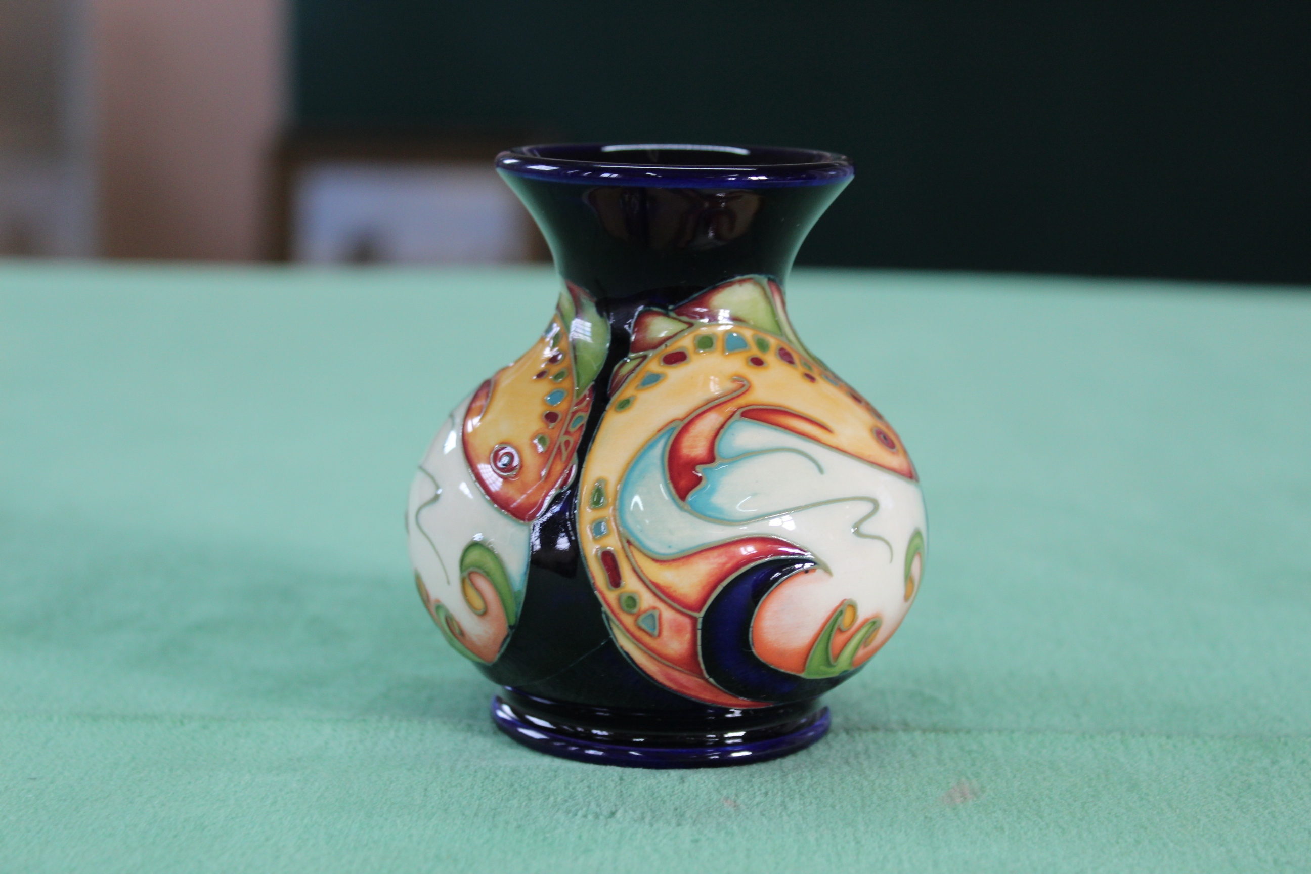 A Moorcroft Shoal pattern vase, 2006 by S Leeper, 3 3/4" high,