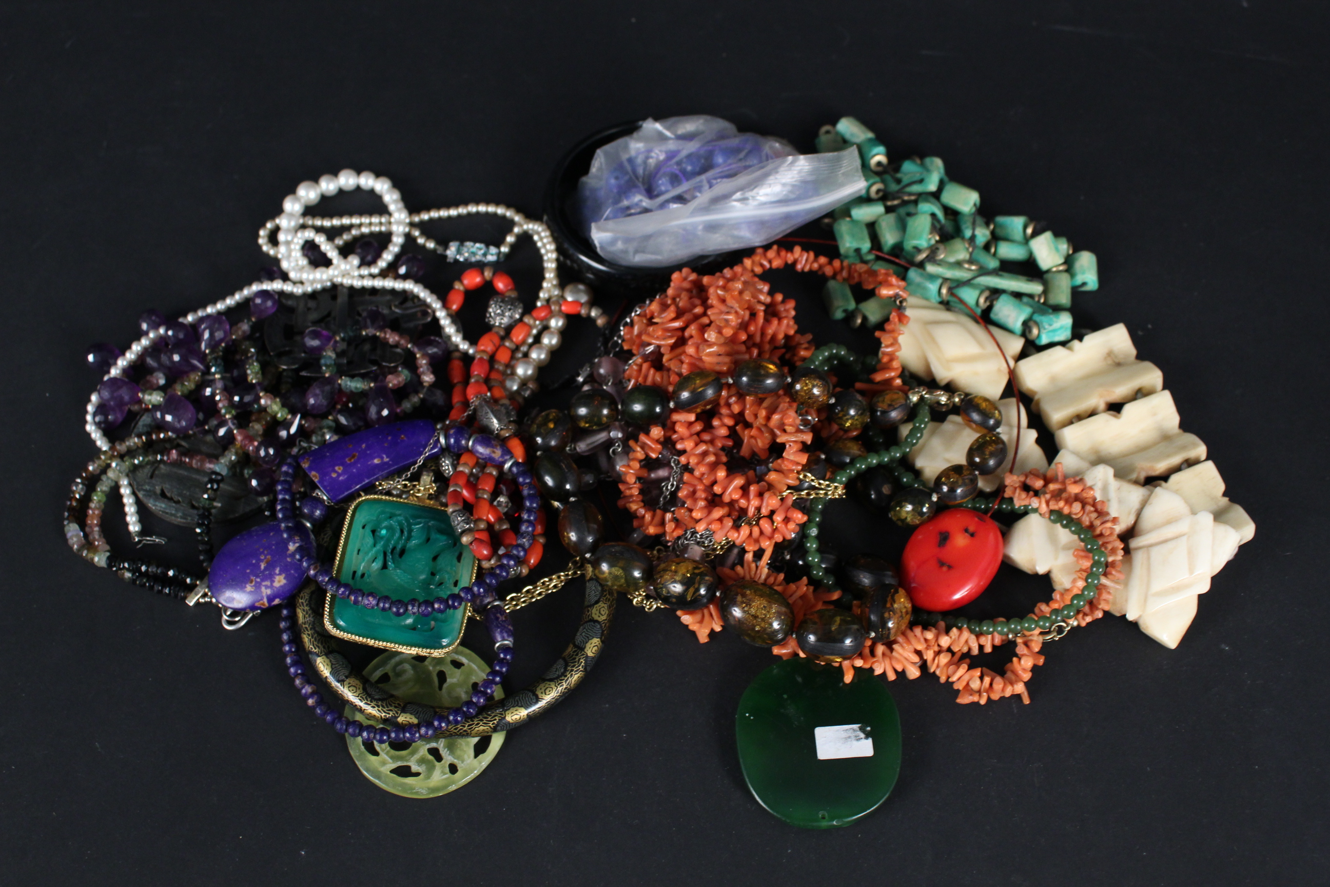 A quantity of bead necklaces, including coral, amethyst etc, bracelets including bone,