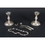 Two silver bladed mother of pearl pen knives, a pair of squat candlesticks,