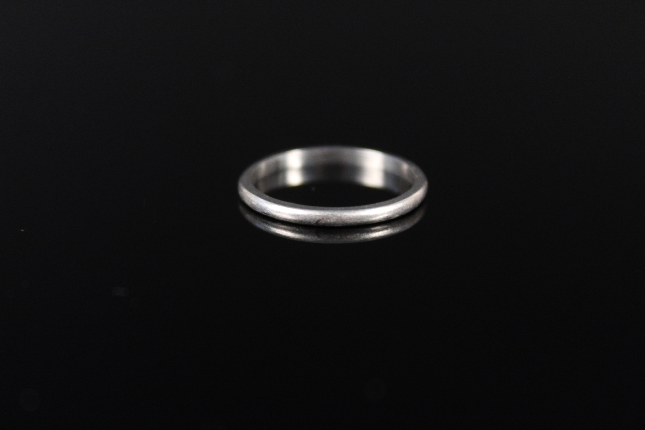 A platinum wedding band, size L 1/2,