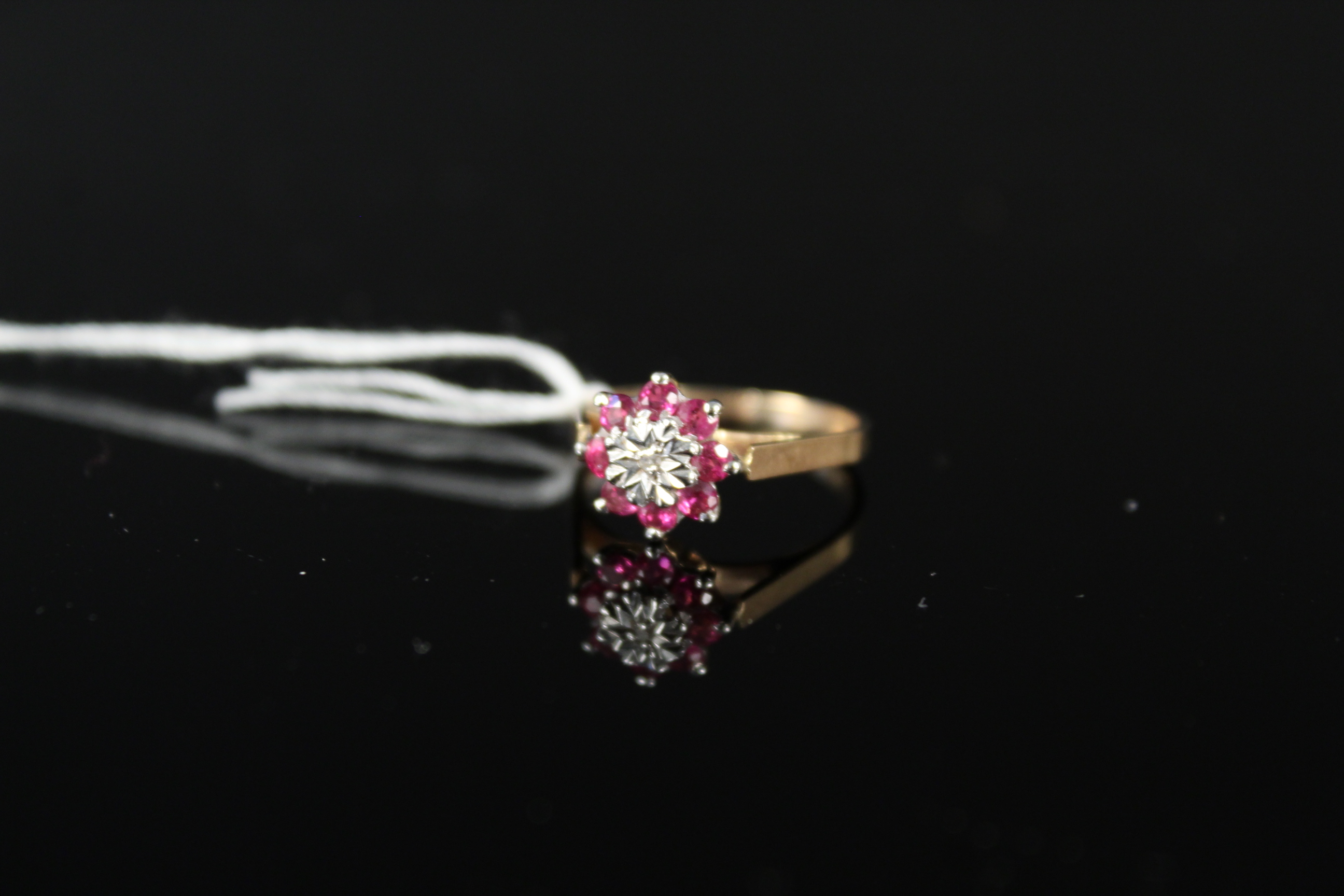 A 9ct gold ruby and diamond ring, size J 1/2,