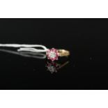 A 9ct gold ruby and diamond ring, size J 1/2,