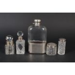 Two silver topped cut glass jars,