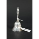 A Georgian silver bell with embossed floral decoration, hallmarked London 1830,